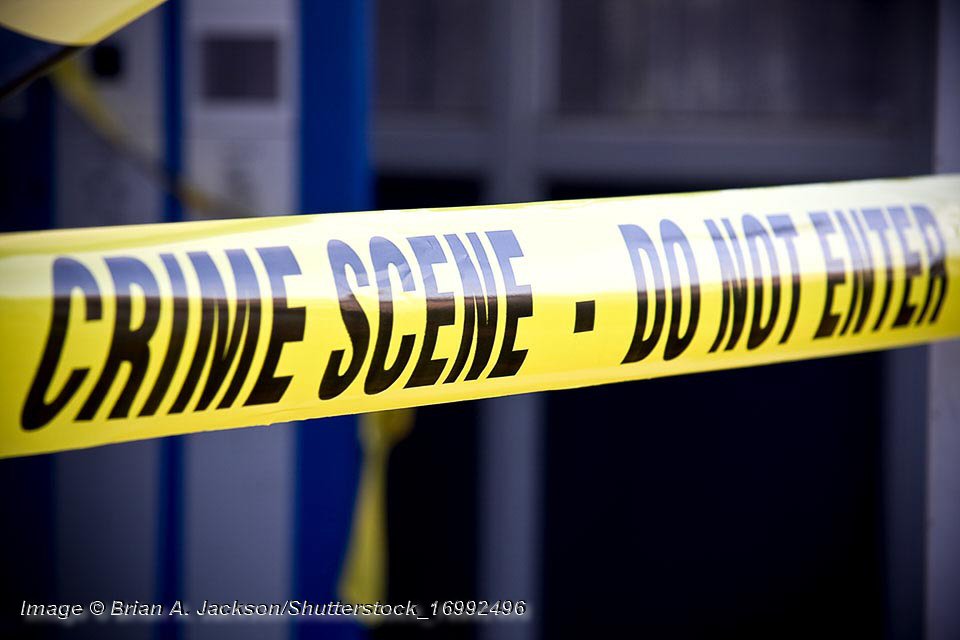 Close up crime scene investigation police boundary tape. © Brian A. Jackson/Shutterstock