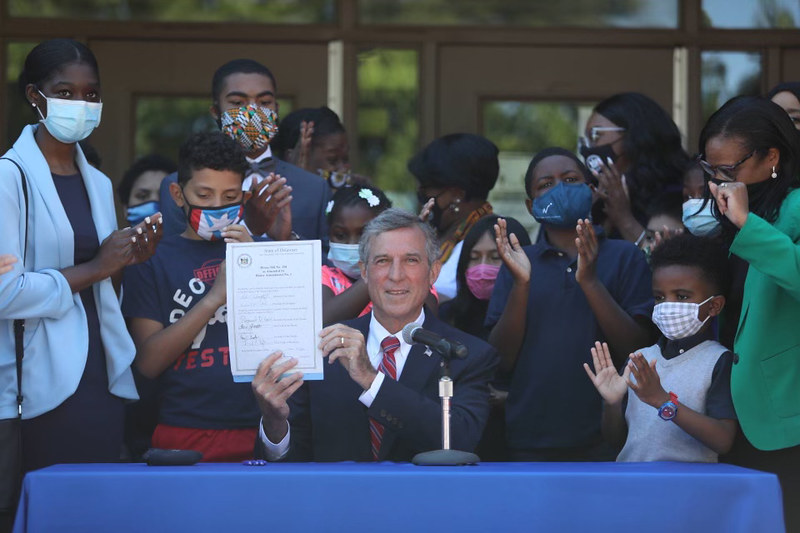 Governor John Carney signs legislation that mandates Black History instruction in Delaware schools (photo courtesy of Governor John Carney's office)
