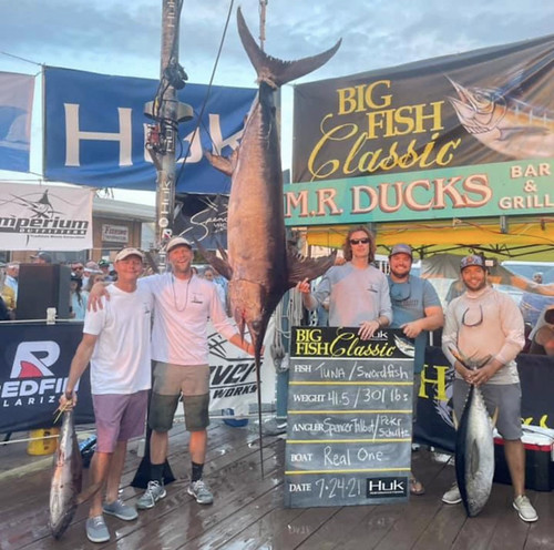 Peter Schultz, second from left, and his team stand with the new state record swordfish. Photo courtesy Big Fish Classic, used with permission.