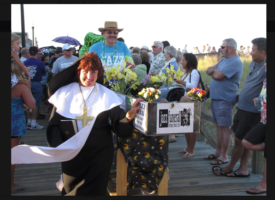 Bethany Beach Jazz Funeral chairwoman Marie Wright and Jazz chairman Paul Jankovic guide “Summer” to her final resting place at the Bethany Beach bandstand during the ceremonies to celebrate the end of the summer season in Bethany Beach, Del. (Submitted photo from Jazz Funeral graphic files)