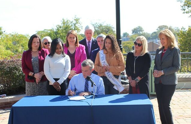 Gov. John Carney signed a tuition waiver program that helps foster children Thursday (photo courtesy of Gov. John Carney's office)