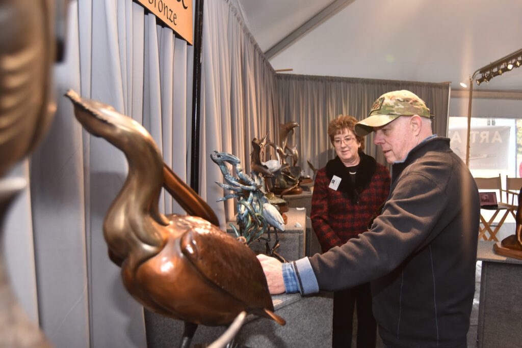 Governor Larry Hogan examines some of the artwork at the 50th Waterfowl Festival in Easton Sunday (photo courtesy of Governor Larry Hogan's office)