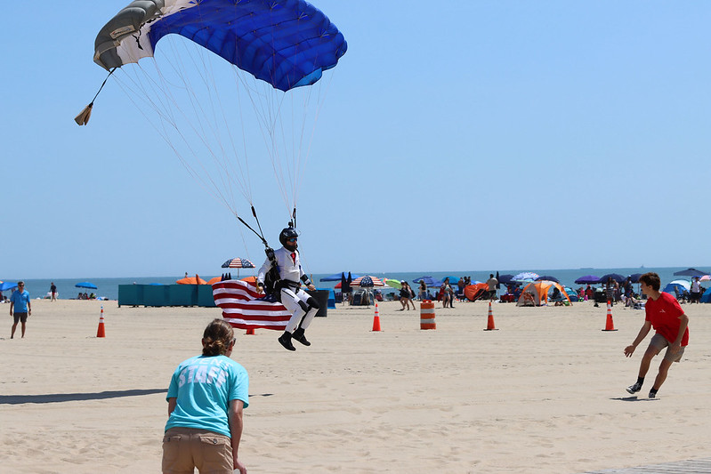 A skydiver delivers the U.S. flag during Memorial Day ceremonies Monday in Ocean City (photo courtesy of the Town of Ocean City)