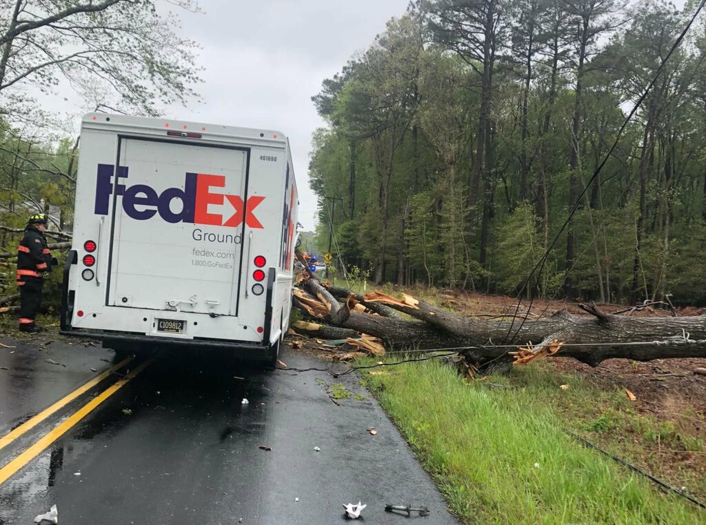 Trees and wires fell on a delivery vehicle Sunday (photo courtesy of Roxana Volunteer Fire Company)