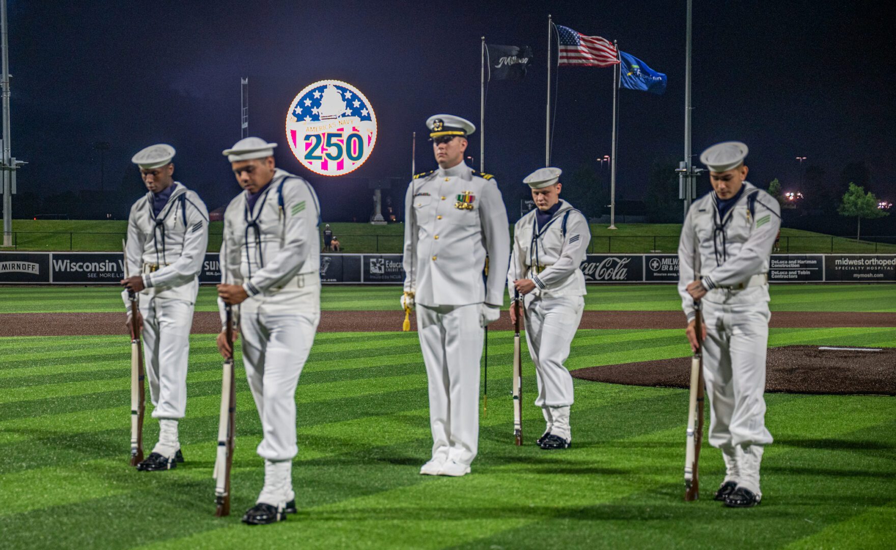 The U.S. Navy Ceremonial Guard performs at a Milwaukee Milkmen baseball game during Milwaukee Navy Week, July 16, 2025. Milwaukee Navy Week is one of 15 Navy Weeks during the Navy’s 250th year celebration, bringing a variety of assets, equipment and personnel to a single city for a weeklong series of engagements designed to bring America’s Navy closer to the people it protects. Each year, the program reaches more than 140 million people - about half the U.S. population (U.S. Navy photo by Mass Communication Specialist 2nd Class Tyler Wheaton/Released)