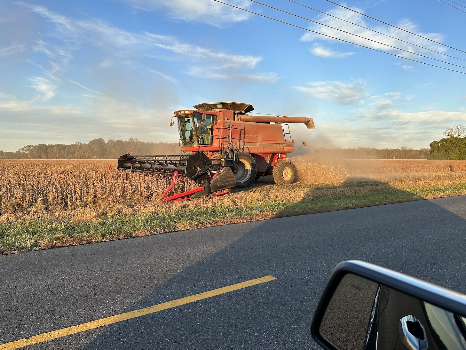 A combine harvesting a DELMARVA field; an archive context image that does not depict the recognized farm or Governor's Day ceremony.