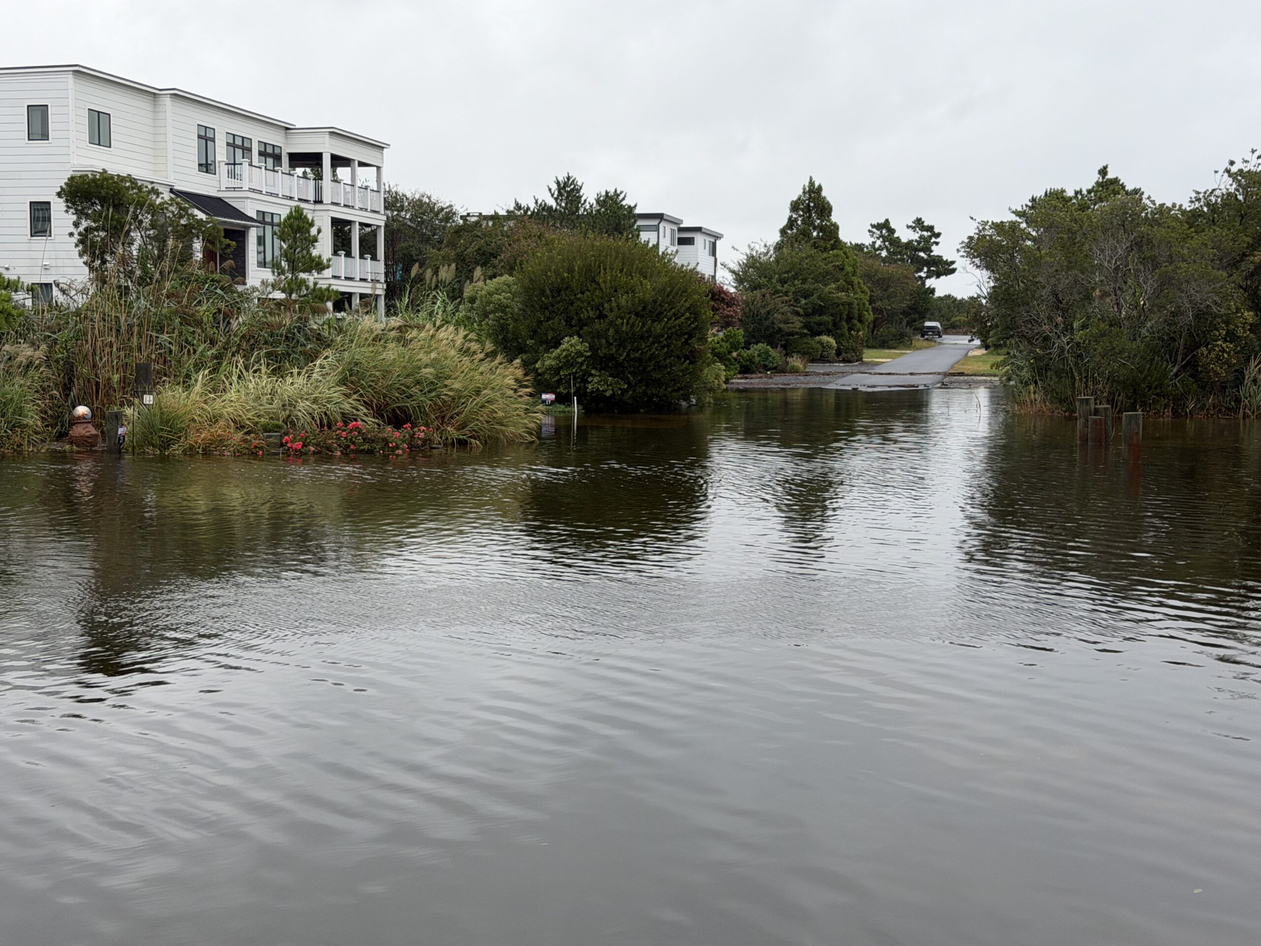 Floodwater reaching landscaped yards between Bethany Beach and Dewey Beach, Delaware