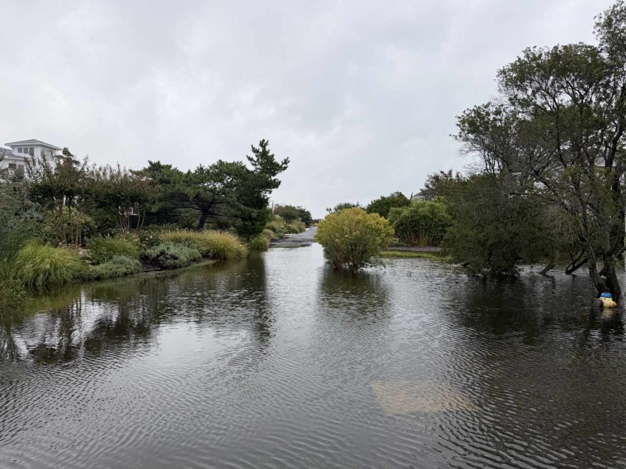 Floodwater filling a residential street between Bethany Beach and Dewey Beach, Delaware