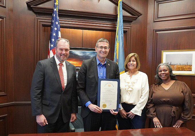 Chief Magistrate Alan Davis, who attended the ceremony along with Court Administrator Elizabeth Petrick and Management Analyst III Jayme Govens / Image courtesy State of Delaware Administrative Office of the Courts