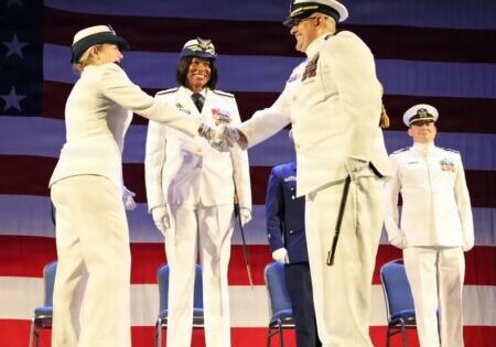 Capt. Capt. Roberto Rivera (right) relieves Capt. Kate Higgins-Bloom (left) as commander of Coast Guard Sector Delaware Bay while Rear Adm. Zeita Merchant (center), commander, Coast Guard East District, presides over a change of command ceremony at the Independence Seaport Museum in Philadelphia / Image courtesy Coast Guard Auxiliarist Leon C. DeFulgentis