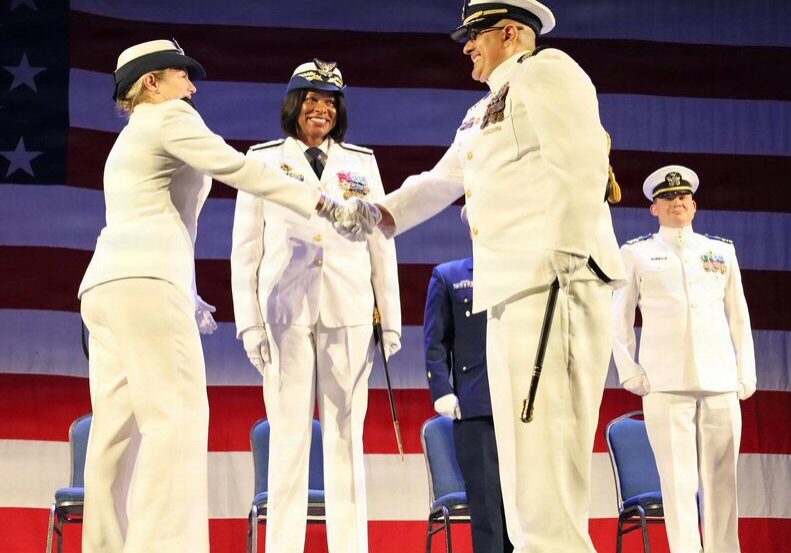 Capt. Capt. Roberto Rivera (right) relieves Capt. Kate Higgins-Bloom (left) as commander of Coast Guard Sector Delaware Bay while Rear Adm. Zeita Merchant (center), commander, Coast Guard East District, presides over a change of command ceremony at the Independence Seaport Museum in Philadelphia / Image courtesy Coast Guard Auxiliarist Leon C. DeFulgentis