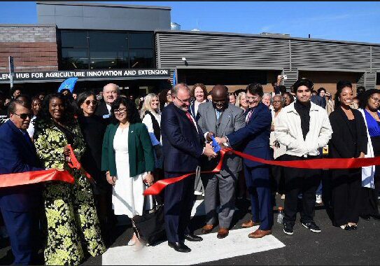 (center) Retired Agilent CEO Mike McMullen, DSU President Tony Allen, and DNREC Secretary Gregory Patterson cut the ribbon on DSU new Agilent Hub for  Agriculture, Innovation, and Extension building. On the left, Dover Mayor Robin R. Christensen and DSU College of Ag, Science and Technology Dean Cherese Winstead take session to the other end of the ribbon / Image courtesy DSU