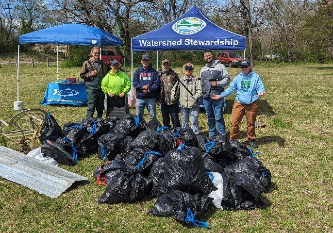 Volunteers celebrate a successful cleanup at Seaford’s Concord Pond in 2024 – the state’s southernmost volunteer cleanup sponsored by DNREC./ DNREC Photo