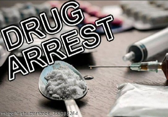 Drug Syringe-Cooked Heroin on Spoon Image © Shutterstock_355085264