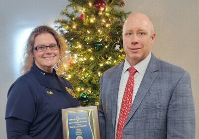 2025 Employee of the Year Kelli Peterson with County Administrator Todd Lawson at Mildred King Luncheon / Image courtesy Sussex County Government