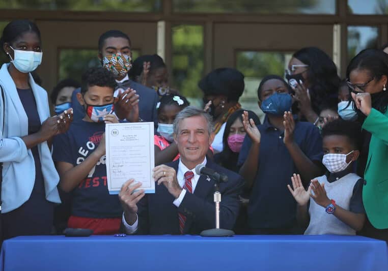 Governor John Carney signs legislation that mandates Black History instruction in Delaware schools (photo courtesy of Governor John Carney's office)