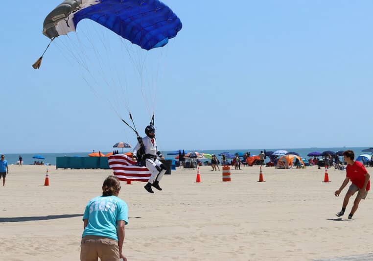 A skydiver delivers the U.S. flag during Memorial Day ceremonies Monday in Ocean City (photo courtesy of the Town of Ocean City)