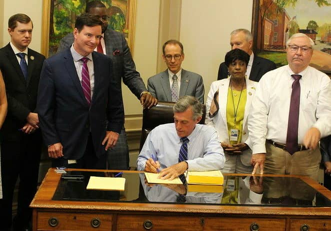 Governor John Carney signed the Delaware FY '23 operating budget Tuesday (photo courtesy of the Office of Gov. John Carney)