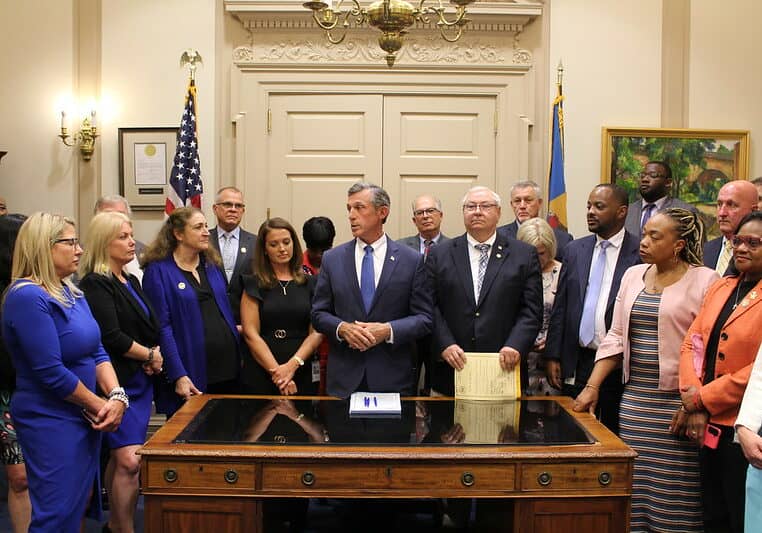 Governor John Carney and legislators gathered following the end of the 151st Delaware General Assembly (photo courtesy of the office of Gov. John Carney)