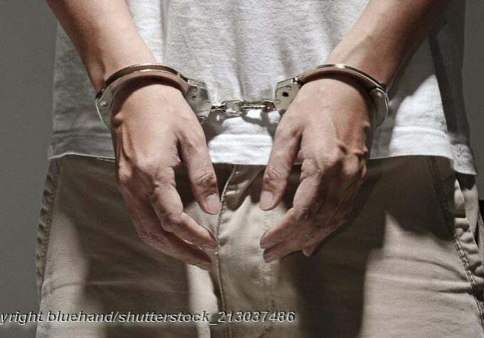 Arrested and Handcuffed - Photo: © Copyright bluehand/shutterstock