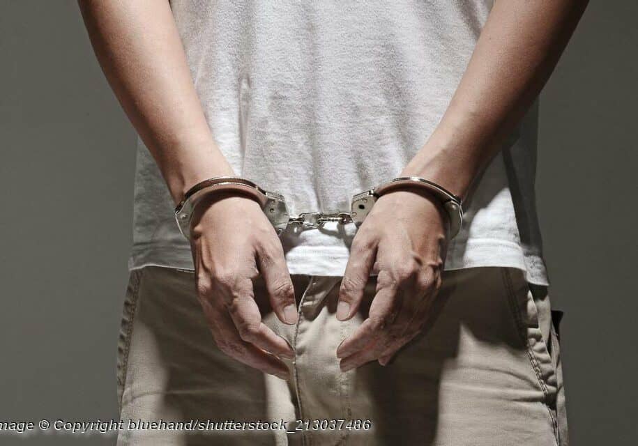 Arrested and Handcuffed - Photo: © Copyright bluehand/shutterstock