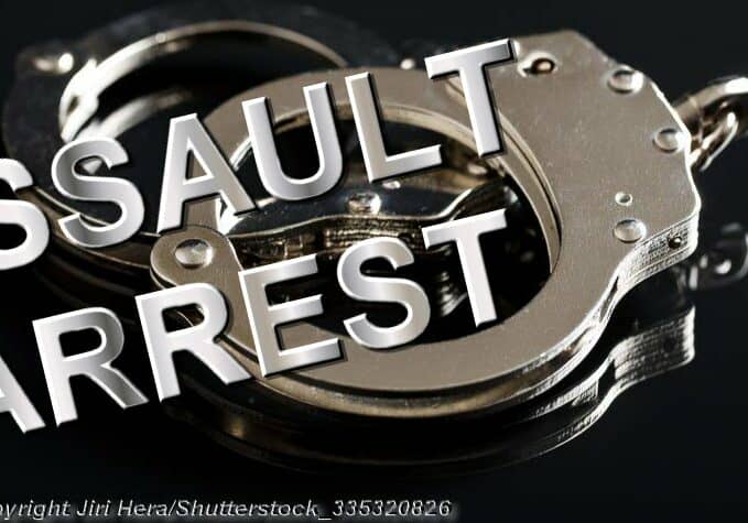 Handcuffs on Black Background - Photo: © Copyright Jiri Hera/Shutterstock