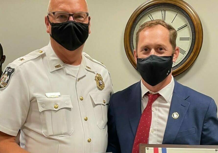 Milford Police Chief Kenneth Brown (left) presents the Law Enforcement Purple Heart to Senior Corporal Timothy Webb (right) - photo courtesy of Milford Police Department, Facebook page