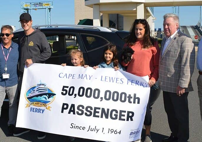 L-R - Director of Ferry Operations, Heath Gehrke; Zach Kaltenbach, Harbor Kaltenbach, Finley Kaltenbach, Jody Kaltenbach, Executive Director Thomas J. Cook, and DRBA Commissioner Ted Becker / Image courtesy DRBA