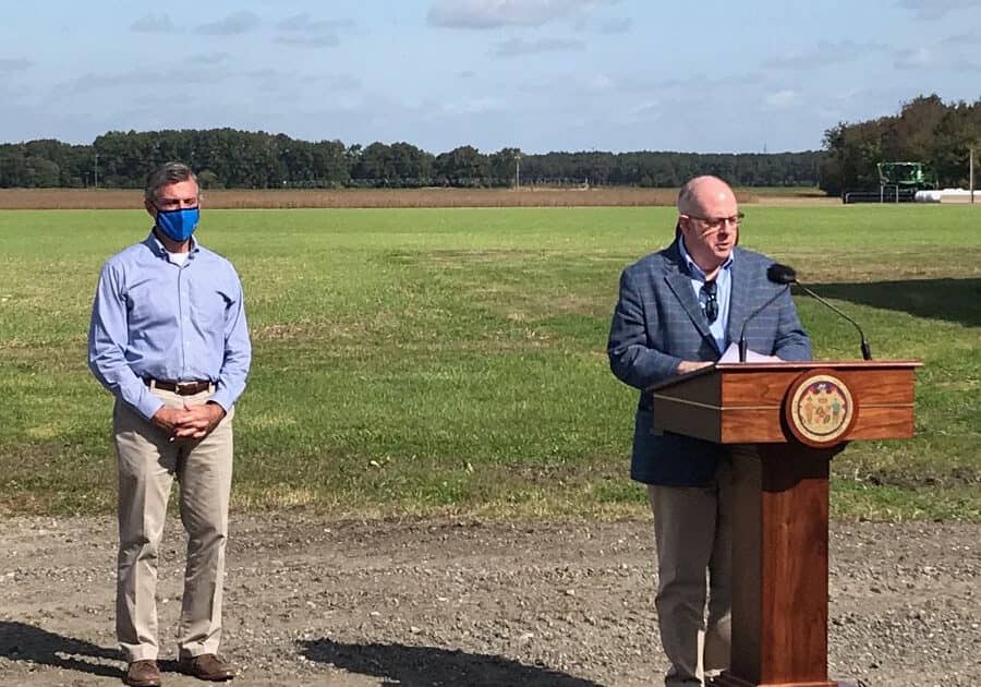 Del. Gov. John Carney (left) and Md. Gov. Larry Hogan (right) discuss an agricultural relief program in Hurlock, Md.