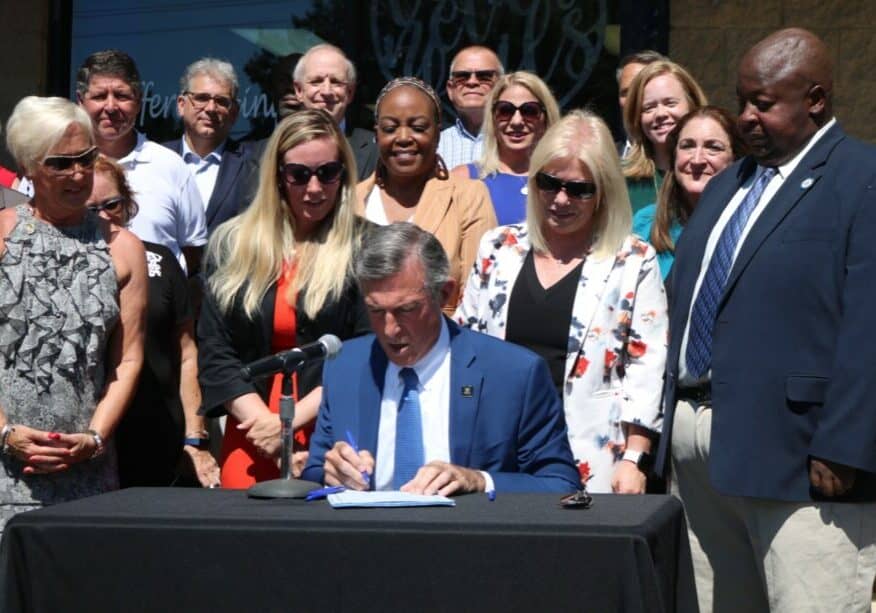 Gov. Carney signed the Delaware EARNS Act Thursday (photo courtesy of Delaware State House Democratic Caucus)