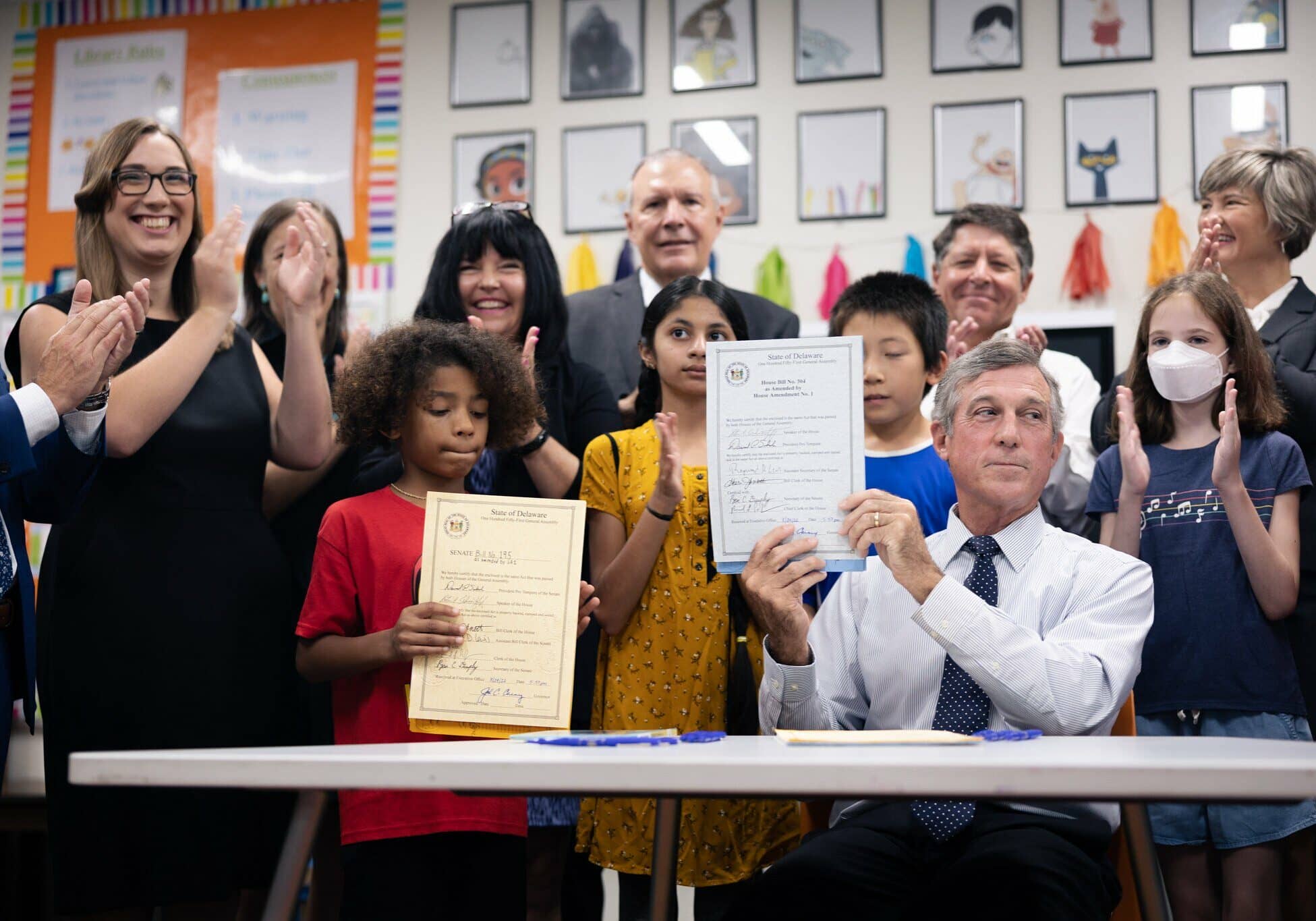 Gov. Carney signed several education-related bills Monday (photo courtesy of Delaware State House Democratic Caucus)