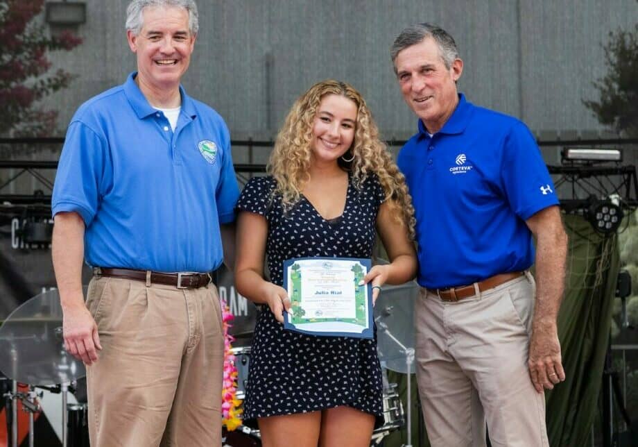 Governor John Carney (right) and DNREC Secretary Shawn M. Garvin congratulate DNREC's High School Young Environmentalist of the Year, Julia Rial of Sussex Academy /DNREC photo.