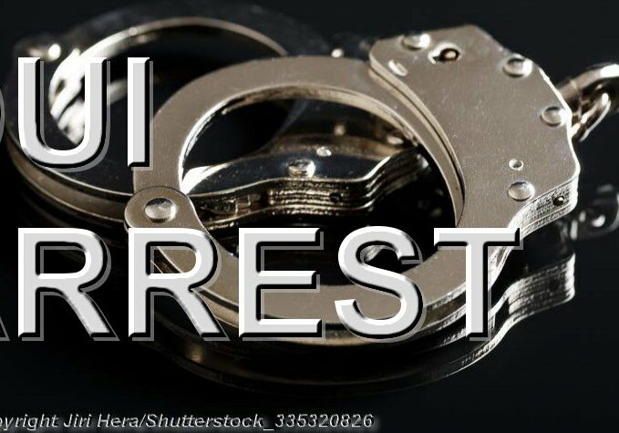 DUI Arrest 3 - Handcuffs on Black Background - Photo: © Copyright Jiri Hera/Shutterstock