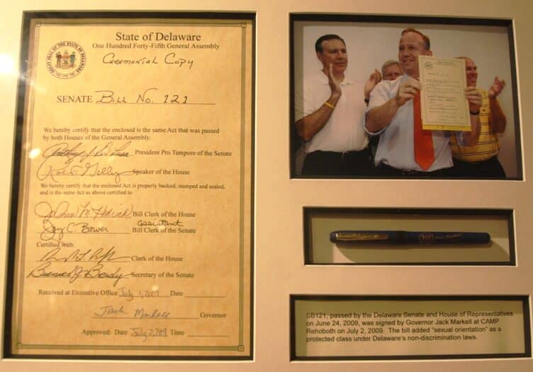 A signed framed copy of Senate Bill No. 121 hangs at the CAMP Rehoboth exhibition in the Rehoboth Beach Museum. Image courtesy WGMD/Alan Henney