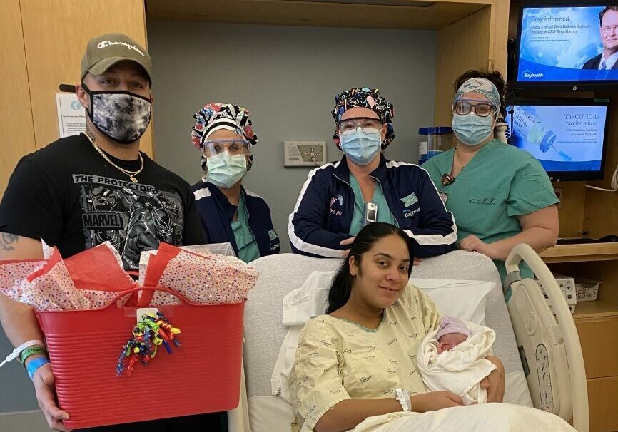 Mother Angelica Batiz and baby Josiah are pictured center. Behind mother and baby from left to right are father Jonathan Rosa; Patricia Boesenberg, LPN; Tanya Brown, RN; and Hillary Reedy, RN.