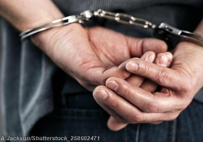 Handcuffs-behind-back-shutterstock_258602471