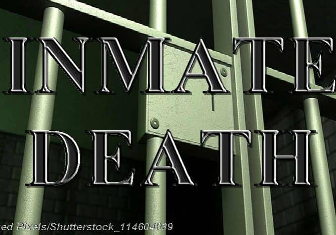 A closeup of the lock of a brick jail cell with iron bars and a door with a locking mechanism - Photo: © Copyright Linked Pixels/Shutterstock_114604039