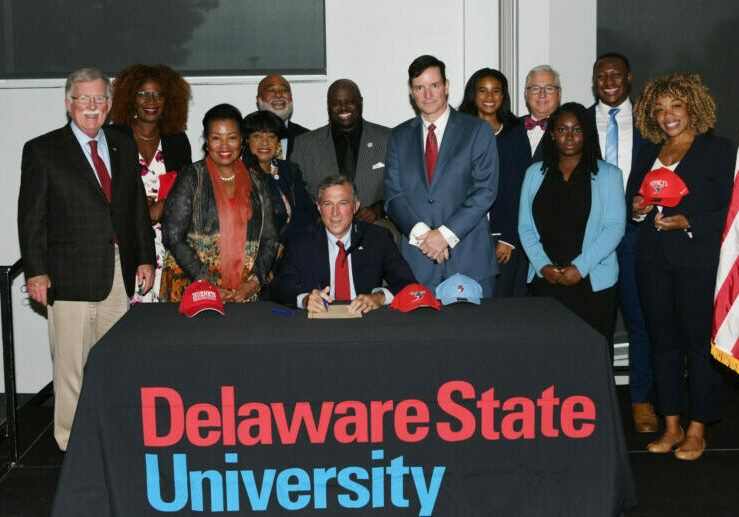 nspire Signing – Gov. John Carney and a crowd of legislators, DSU officials and students, just prior to the governor’s signing of the legislation. Photo courtesy of DSU