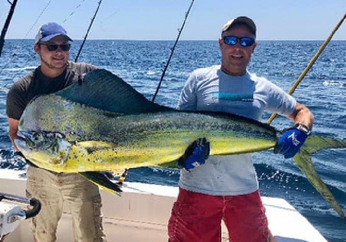 Jeff Wright (right) of Cambridge caught this 72.8-pound common dolphinfish off the coast of Ocean City.  Image courtesy MD DNR
