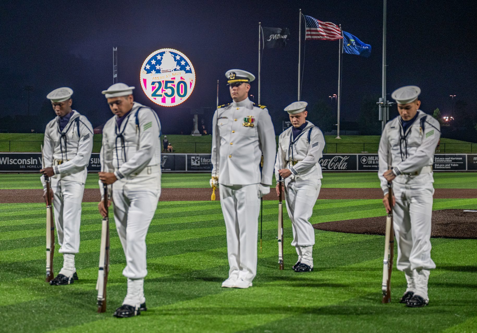 The U.S. Navy Ceremonial Guard performs at a Milwaukee Milkmen baseball game during Milwaukee Navy Week, July 16, 2025. Milwaukee Navy Week is one of 15 Navy Weeks during the Navy’s 250th year celebration, bringing a variety of assets, equipment and personnel to a single city for a weeklong series of engagements designed to bring America’s Navy closer to the people it protects. Each year, the program reaches more than 140 million people - about half the U.S. population (U.S. Navy photo by Mass Communication Specialist 2nd Class Tyler Wheaton/Released)
