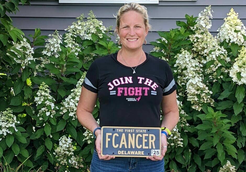 Kari Lynn Overington of Milton poses with the Delaware vanity tag that was recalled by the DMV (photo shared by ACLU of Delaware)