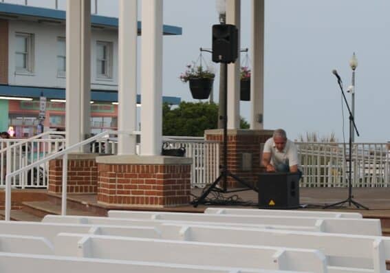 Dr. Michael Rawlins, a college professor, says he had been entertaining visitors who would stop and listen to him strumming an acoustic guitar while singing classic rock tunes such as the Beatles, Rolling Stones, Elvis, Johnny Cash, among others. Image courtesy WGMD/Alan Henney.