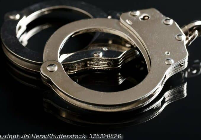 Silver handcuffs on black background
Image © Jiri Hera-shutterstock_335320826 