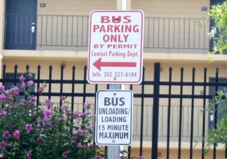 Sign reserving the two bus parking spaces behind the firehouse near city hall. Image courtesy WGMD/Alan Henney

