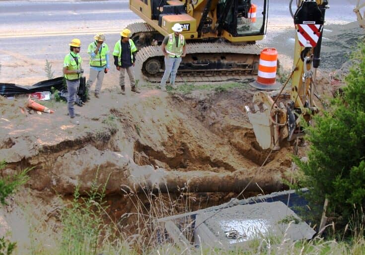 Construction crews worked into the evening Thursday to help support a water main that had been excavated by a contractor. Image courtesy WGMD/Alan Henney
